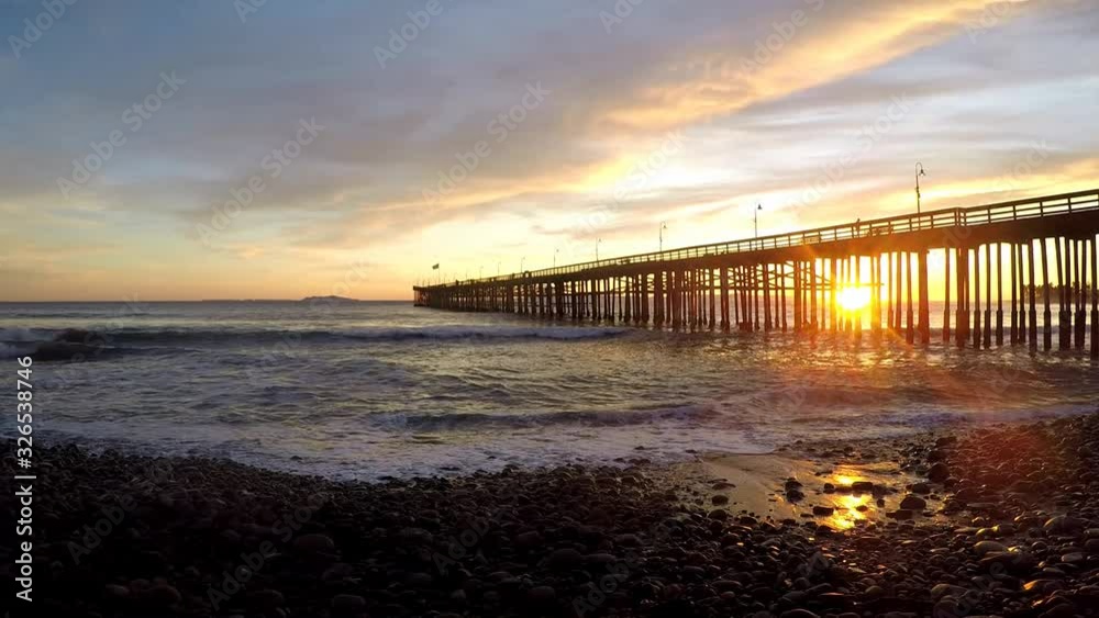 Peaceful Shoreline Beach Sunset near Pier Peaceful Shoreline Beach Sunset near Pier