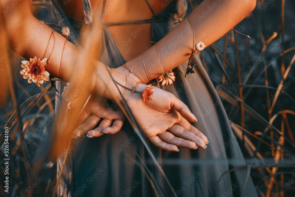 close up of young and tender woman hands crossed behind the back - obrazy, fototapety, plakaty 