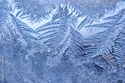 Photographing macro ice on the glass in winter Patterned like leaves