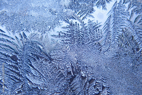 Photographing macro ice on the glass in winter Patterned like leaves