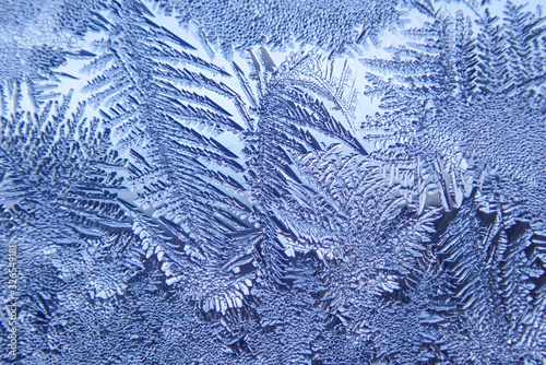 Photographing macro ice on the glass in winter Patterned like leaves