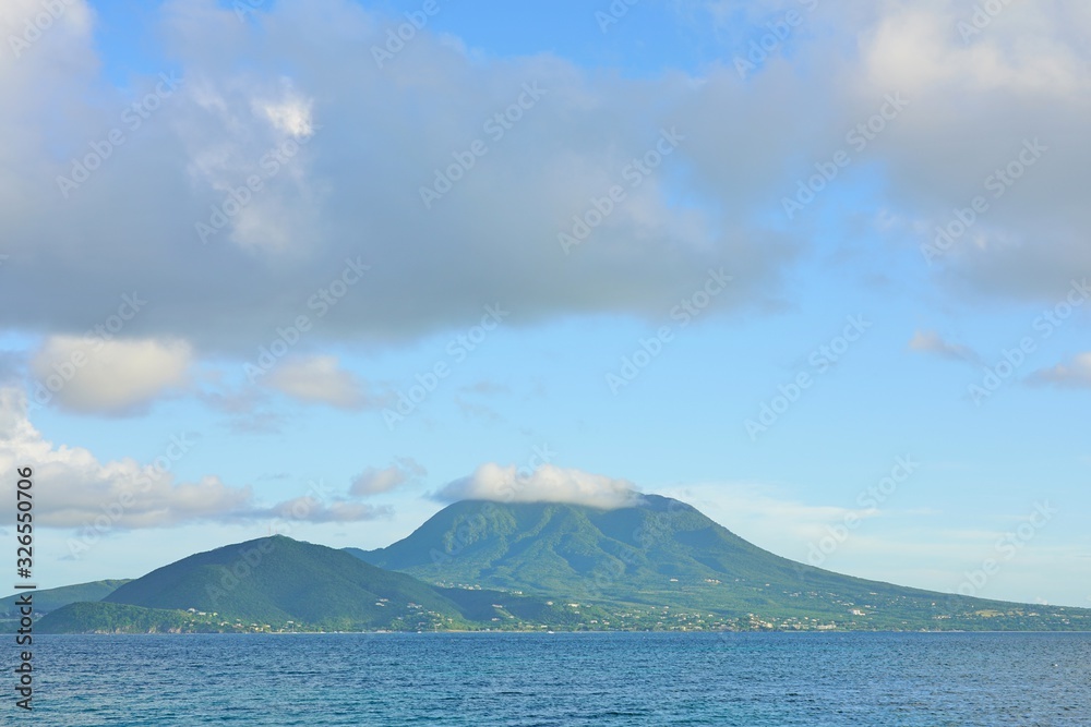 Day view of the Nevis Peak volcano across the water from St Kitts