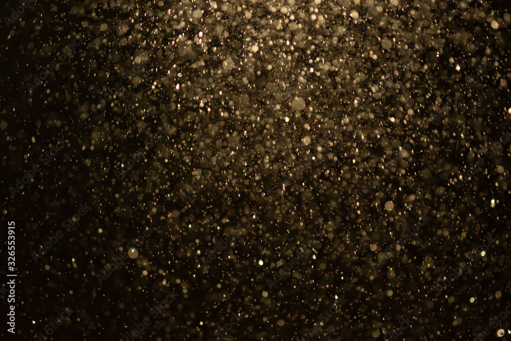 Golden glitter bokeh of light.Abstract blurred light
