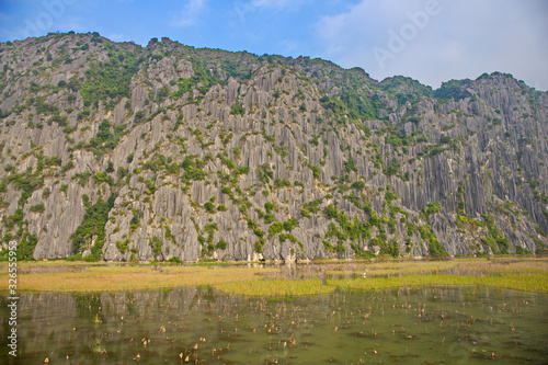 VANLONG NATURAL RESERVE, NINH BINH, VIETNAM - MAR. 1, 2016: Landscape inside Van Long Natural Reserve. This is a famous sightseeing in Vietnam. photo