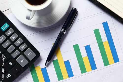 close up of financial chart and calculator on table, using self created chart 