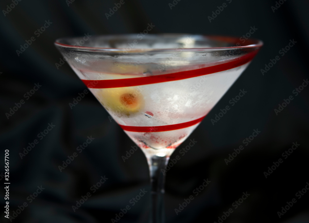 Ice Cold Martini Made with Gin, Vermouth, and an Olive, Taken with Soft Focus Lens