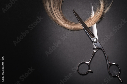 Fotografija Scissors and piece of blond hair