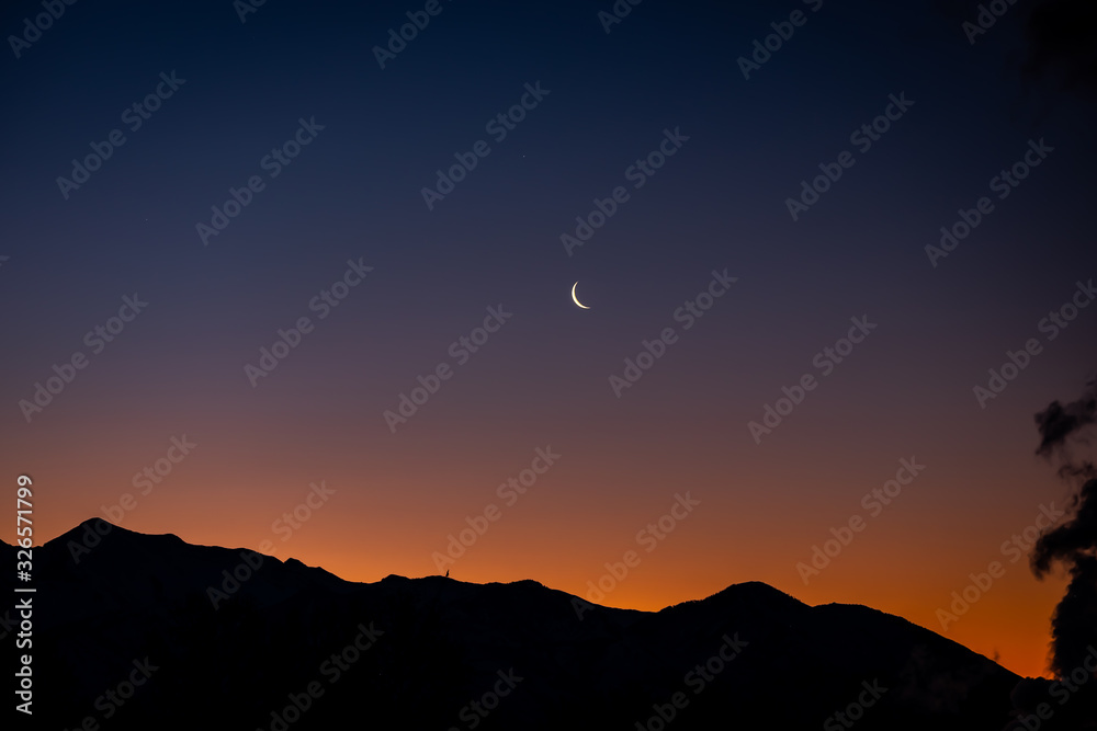 Beautiful morning sunrise over silhouette of Utah mountain range