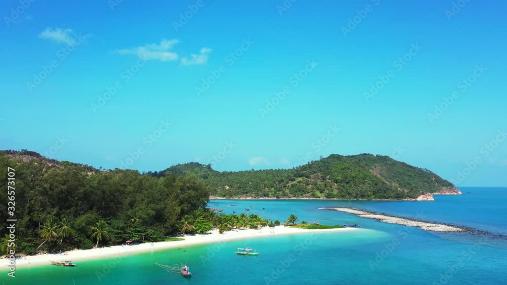 North coast of Koh Phangan, Thailand. Peaceful lagoon with turquoise water and sandy Malibu beach North coast of Koh Phangan, Thailand. Peaceful lagoon with turquoise water and sandy Malibu beach