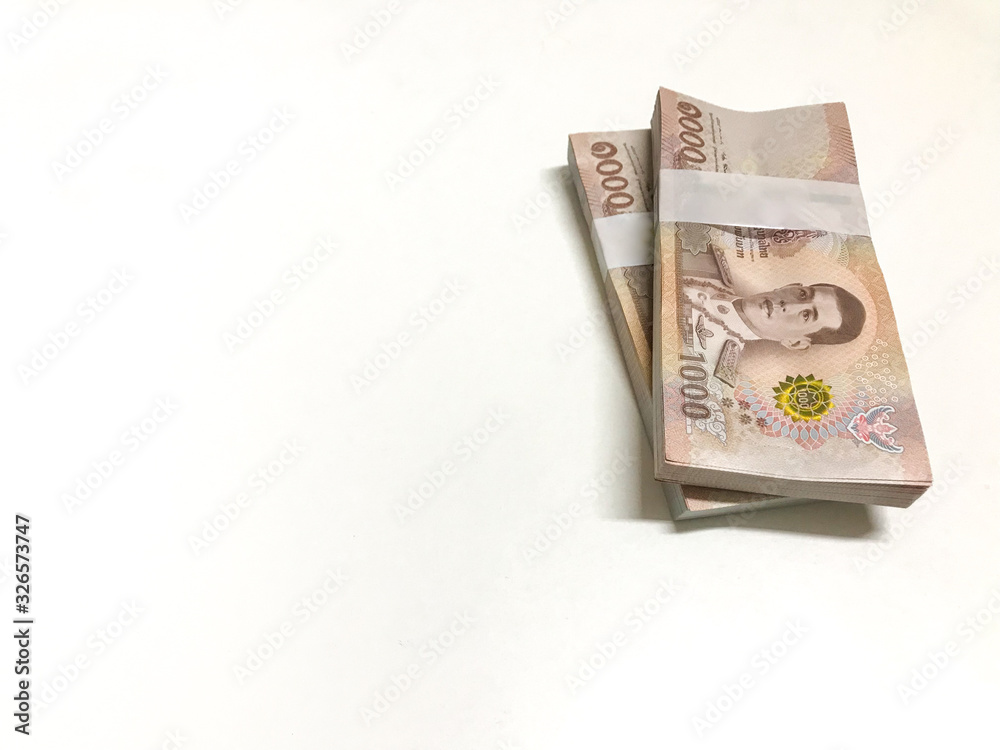 Stacked of cash 1000 baht banknote Thai isolated on white background. Savings and investing concept Pile of cash bills amount million. Stacked of cash 1000 baht banknote Thai isolated on white background. Savings and investing concept Pile of cash bills amount million.
