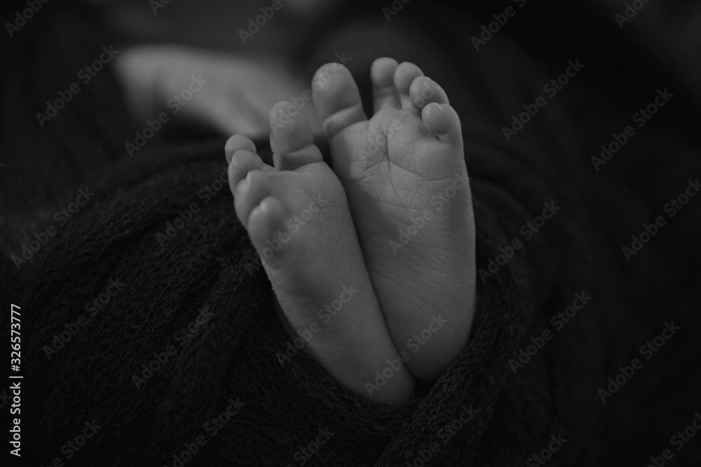 Newborn Baby's feet. legs massage concept of childhood, health care, IVF, hygiene Newborn Baby's feet. legs massage concept of childhood, health care, IVF, hygiene