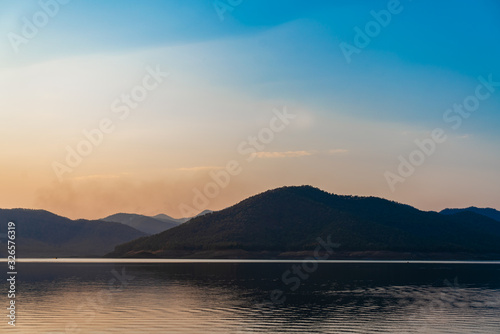 Scenery lake and mountain with sunset for holiday