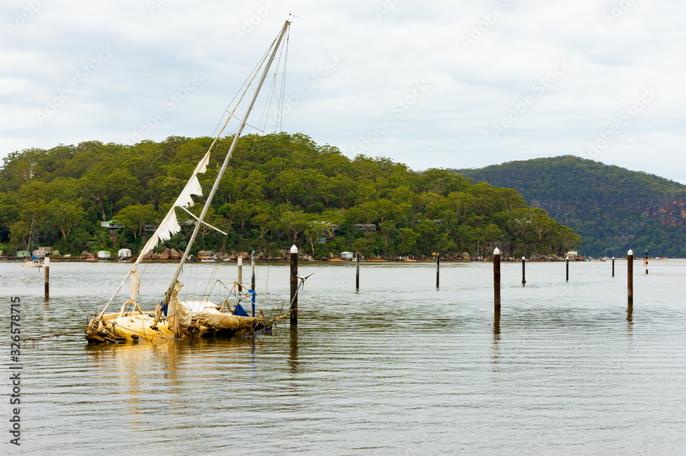 Sunken yacht on the hawksbury river in a rural area of North Sydney, Australia. Sunken yacht on the hawksbury river in a rural area of North Sydney, Australia.