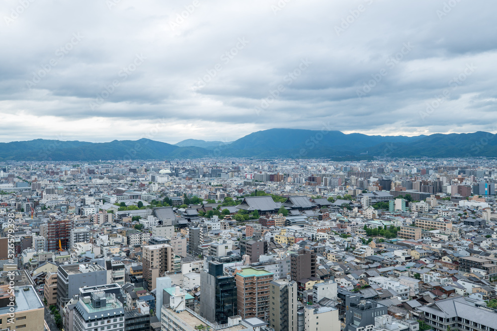 Aerial view of the Kyoto cityscapes during the twilight in a cloudy day, Japan