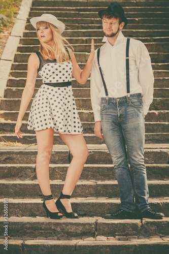 Wallpaper Mural Loving couple retro style flirting on stairs Torontodigital.ca
