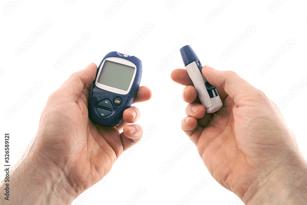 Glucometer and the lancing device in hands, isolated on white background Glucometer and the lancing device in hands, isolated on white background