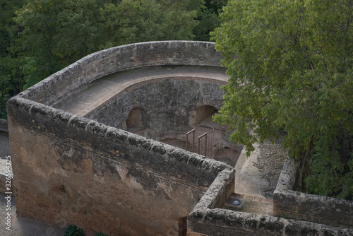 Granada Alhambra traditional spanish building, fortress, palace, stronghold, castle with garden and fountain