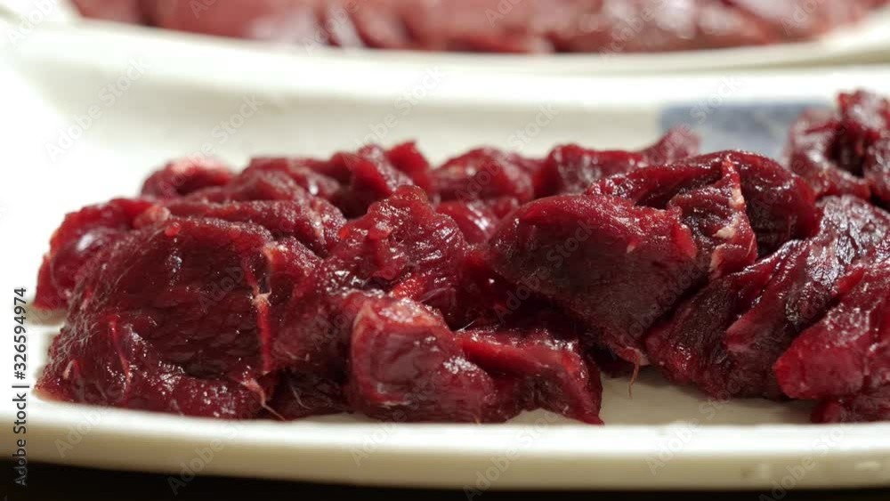 JAPANESE FOOD: Sliced premium raw whale meat on dish. Close up, tracking shot 4K JAPANESE FOOD: Sliced premium raw whale meat on dish. Close up, tracking shot 4K