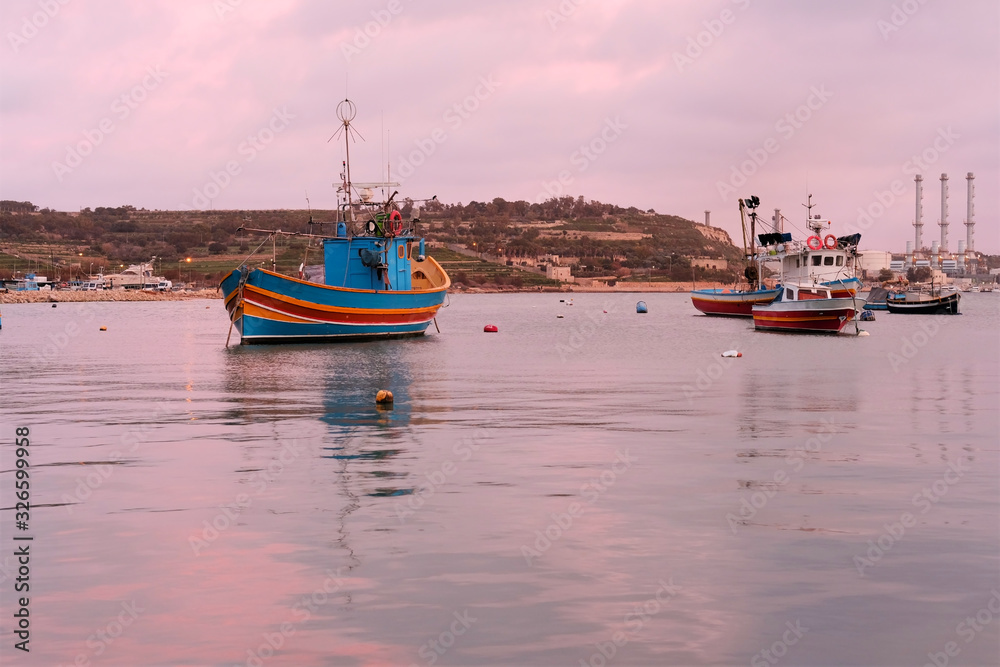 Fototapeta premium scenic view of traditional boats 'luzzu' at the harbour in Marsaxlokk