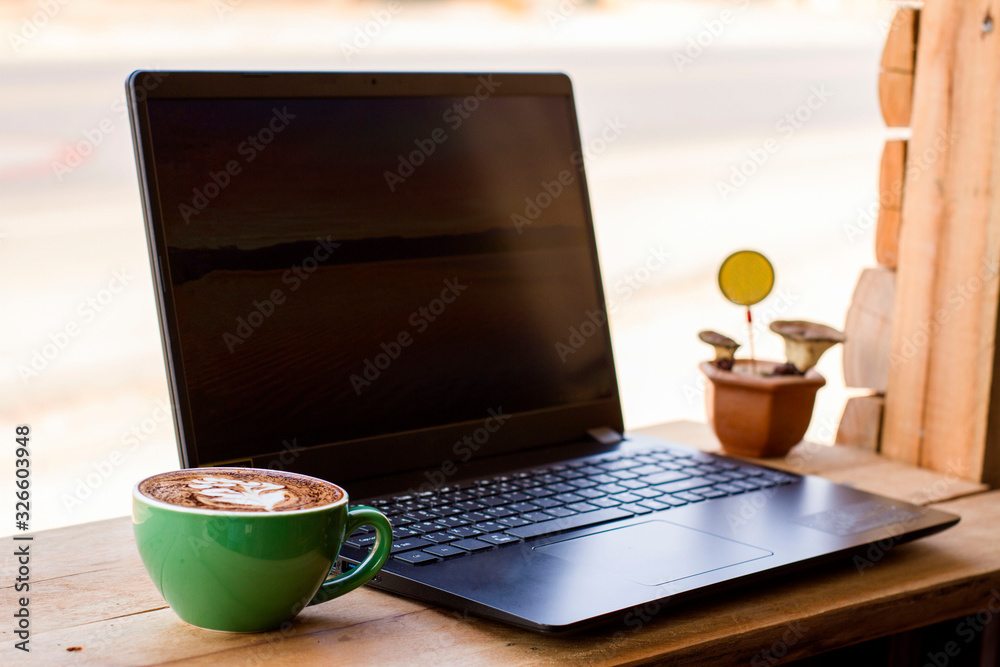 Obraz premium Notebook and coffee mugs in the office