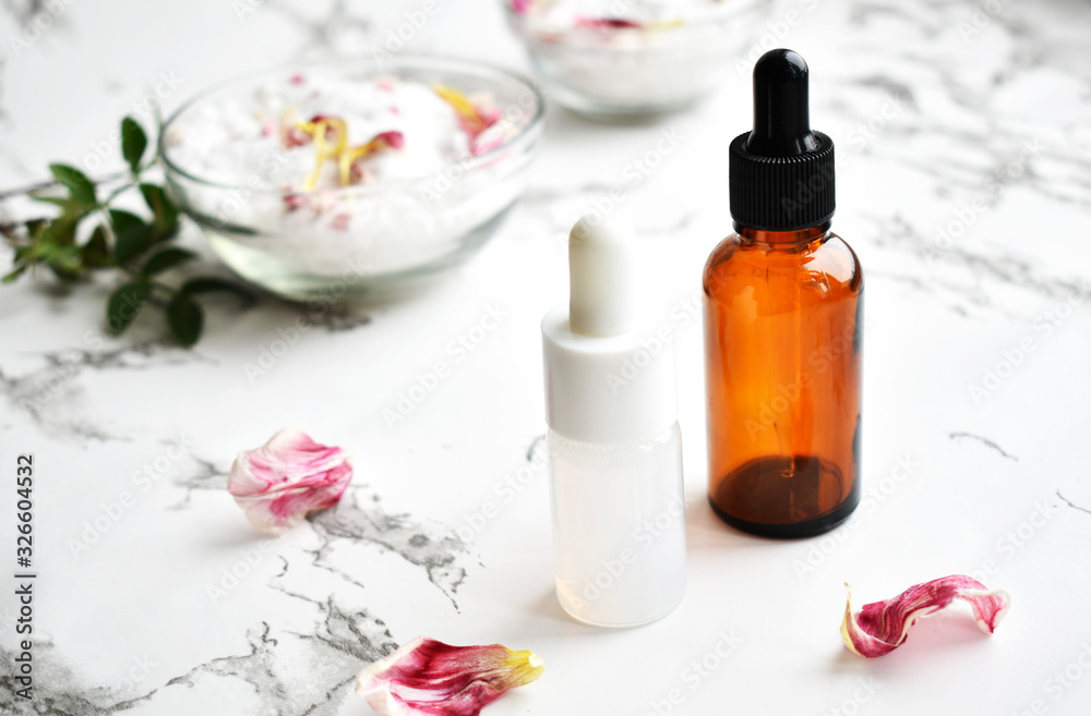 Set of cosmetics for women's skin and body care, sea salt on a gray marble background. Beauty blogger, concept of salon procedures. Flat lay, top view Set of cosmetics for women's skin and body care, sea salt on a gray marble background. Beauty blogger, concept of salon procedures. Flat lay, top view