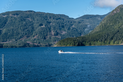 Small Speed Boat Moving across View of Alberni Inlet, Vancouver Island, B.C. © Sheila O'Brian