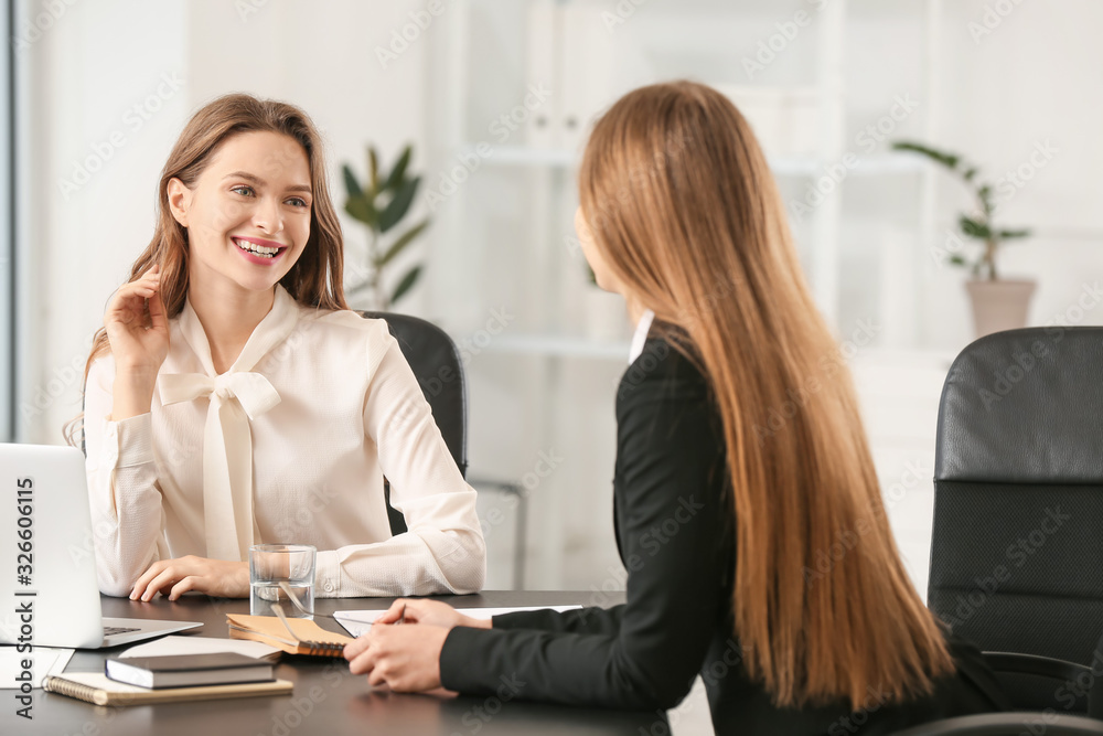 Beautiful young businesswomen working together in office Beautiful young businesswomen working together in office
