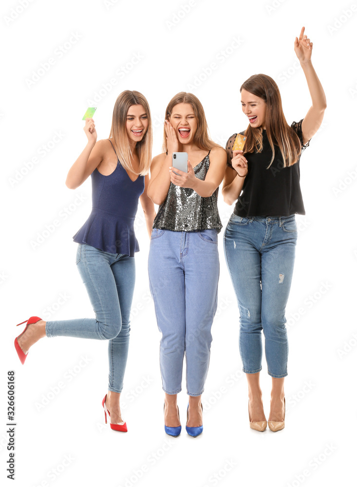 Young women with mobile phone and credit cards on white background. Online shopping concept Young women with mobile phone and credit cards on white background. Online shopping concept