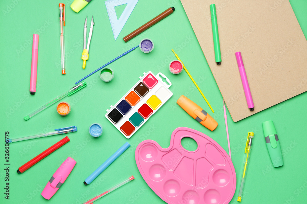 Set of school supplies on color background