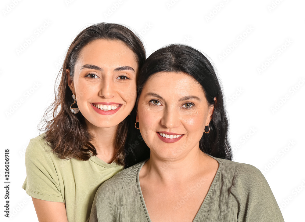 Portrait of adult daughter and her mother on white background Portrait of adult daughter and her mother on white background