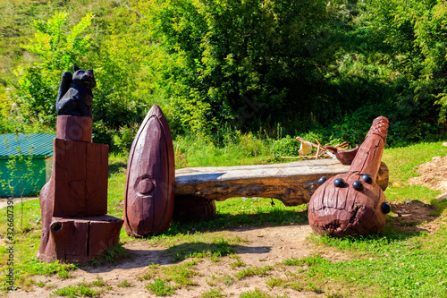 Wooden sculpture of mace of epic hero Ilya Muromets in Karacharovo village near Murom, Russia photo