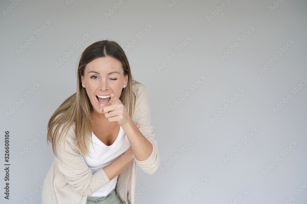 Portrait of beautiful and cheerful woman pointing at camera, isolated Portrait of beautiful and cheerful woman pointing at camera, isolated