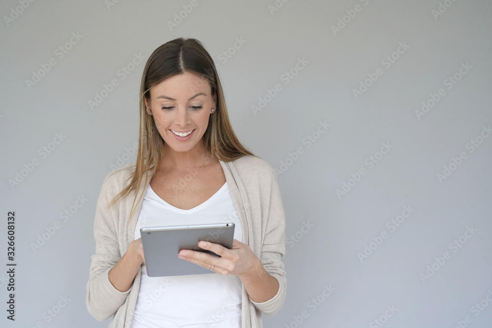 Portrait of beautiful woman using digital tablet, isolated Portrait of beautiful woman using digital tablet, isolated