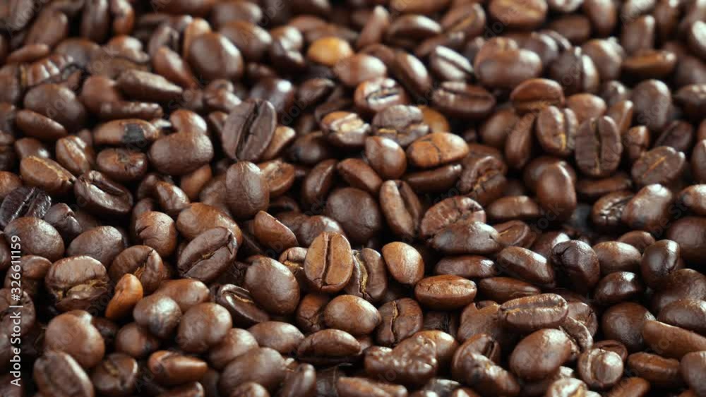 Hot and steaming coffee beans are mixed while roasting Hot and steaming coffee beans are mixed while roasting