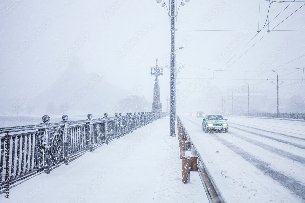 Traffic on snow covered bridge during heavy snow storm Traffic on snow covered bridge during heavy snow storm