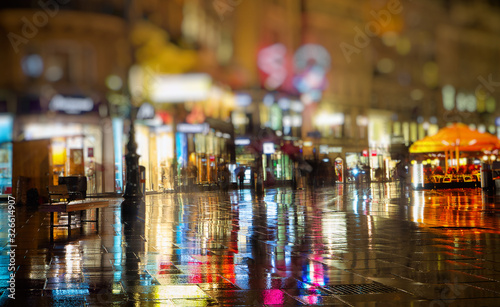 pedestrians walking on rainy night in the city vienna  © babaroga