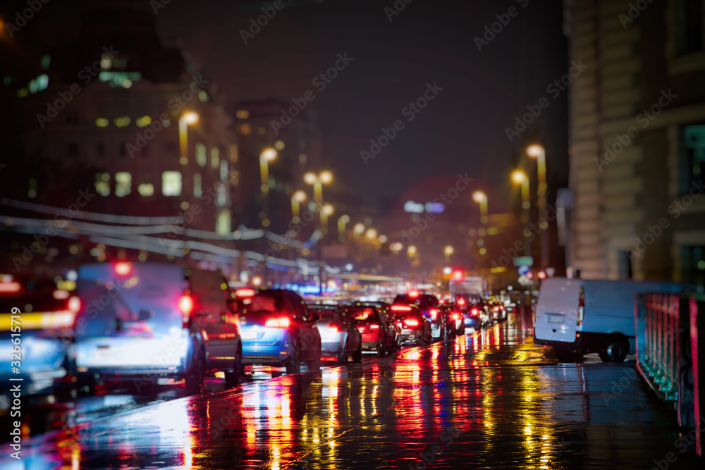 busy traffic in the city on rainy night busy traffic in the city on rainy night