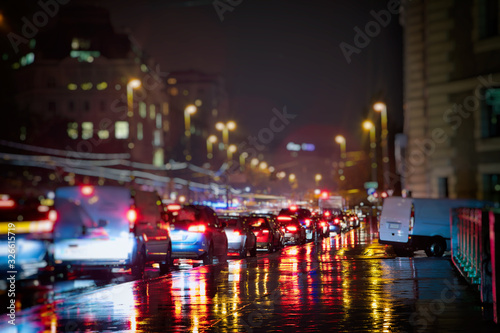 busy traffic in the city on rainy night