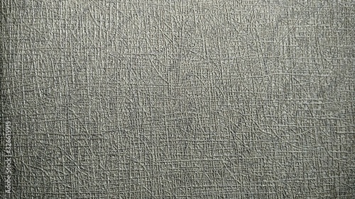 a photo of the pattern and texture of the gray wallpaper that adorns the walls