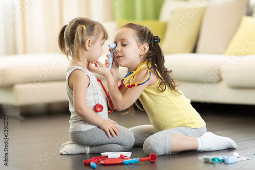 Children girls play doctor ...