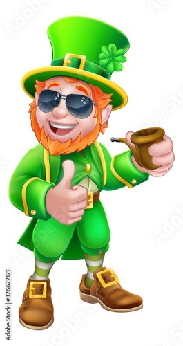 A Leprechaun St Patricks Day cartoon character mascot wearing cool sunglasses, holding a pipe and giving a thumbs up