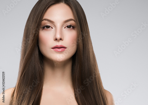Woman face beauty healthy clean skin natural make up brunette hair close up female portrait