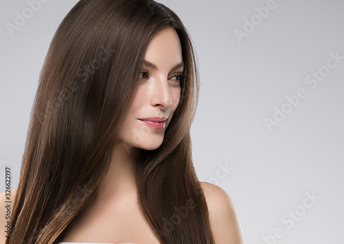 Quadro su tela Beautiful female face healthy natural skin fashion make up brunette smooth hair