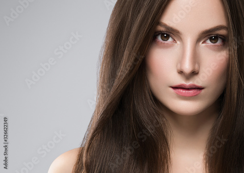 Woman face beauty healthy clean skin natural make up brunette hair close up female portrait