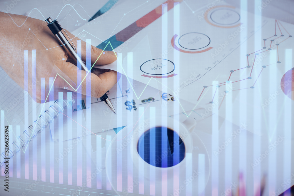 Multi exposure of man planing investment with stock market forex chart. Multi exposure of man planing investment with stock market forex chart.