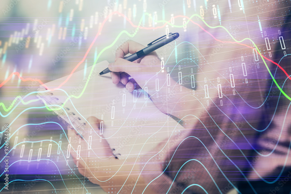 Multi exposure of hands making notes with forex chart huds. Stock market concept. Multi exposure of hands making notes with forex chart huds. Stock market concept.