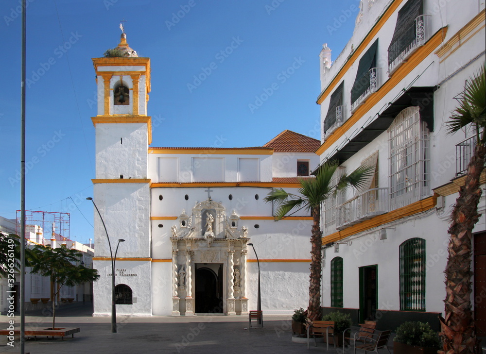 Urban city square and the baroque convent church of Jesus Nazareno in the old town of Chiclana de la Frontera, Andalusia in Spain
