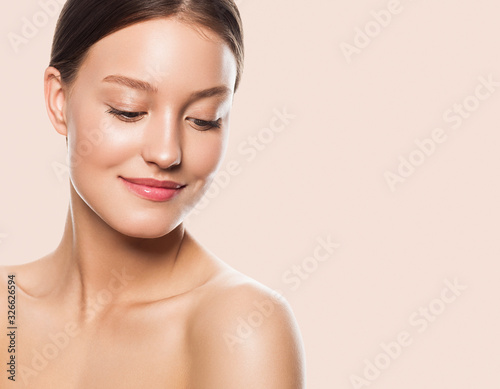 Woman face clean skin looking down eyes without make up fresh clean beauty model