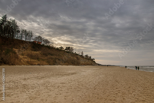 calm landscape of the beach on the Polish Baltic Sea on a cloudy February day photo