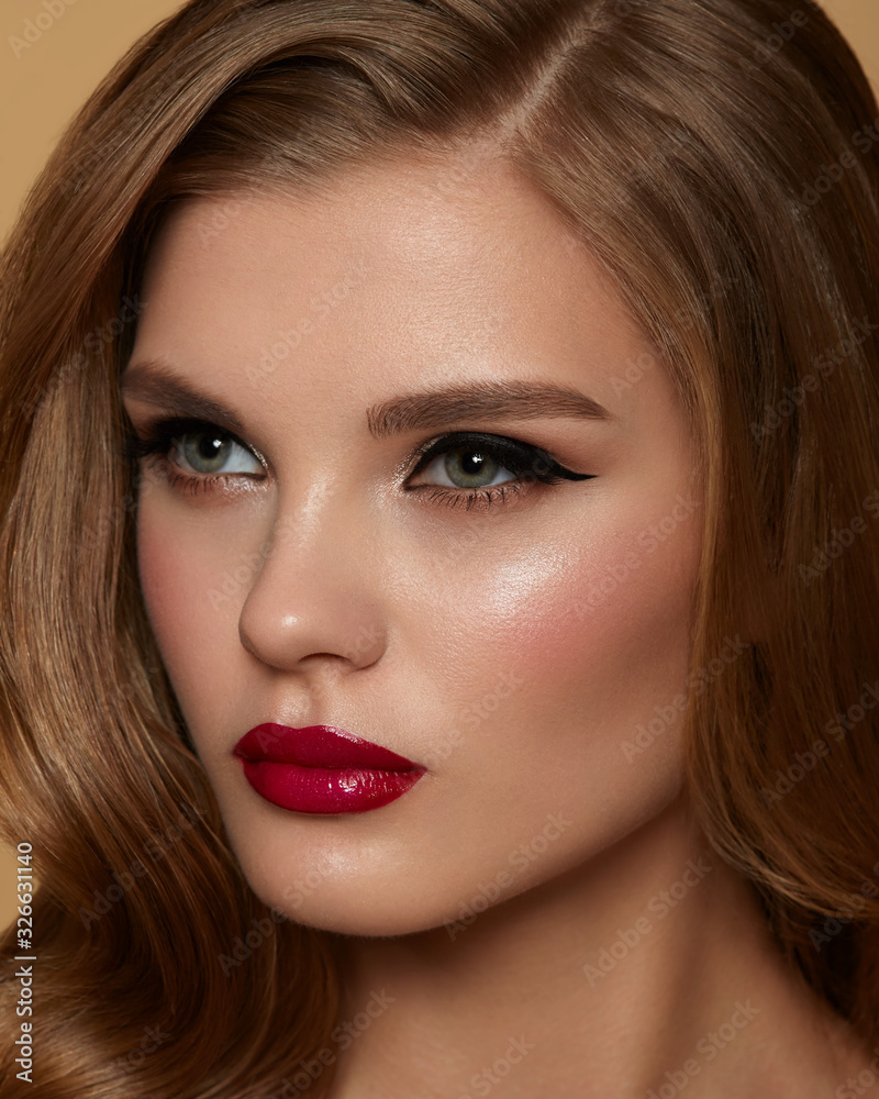 Beautiful young model with red lips
